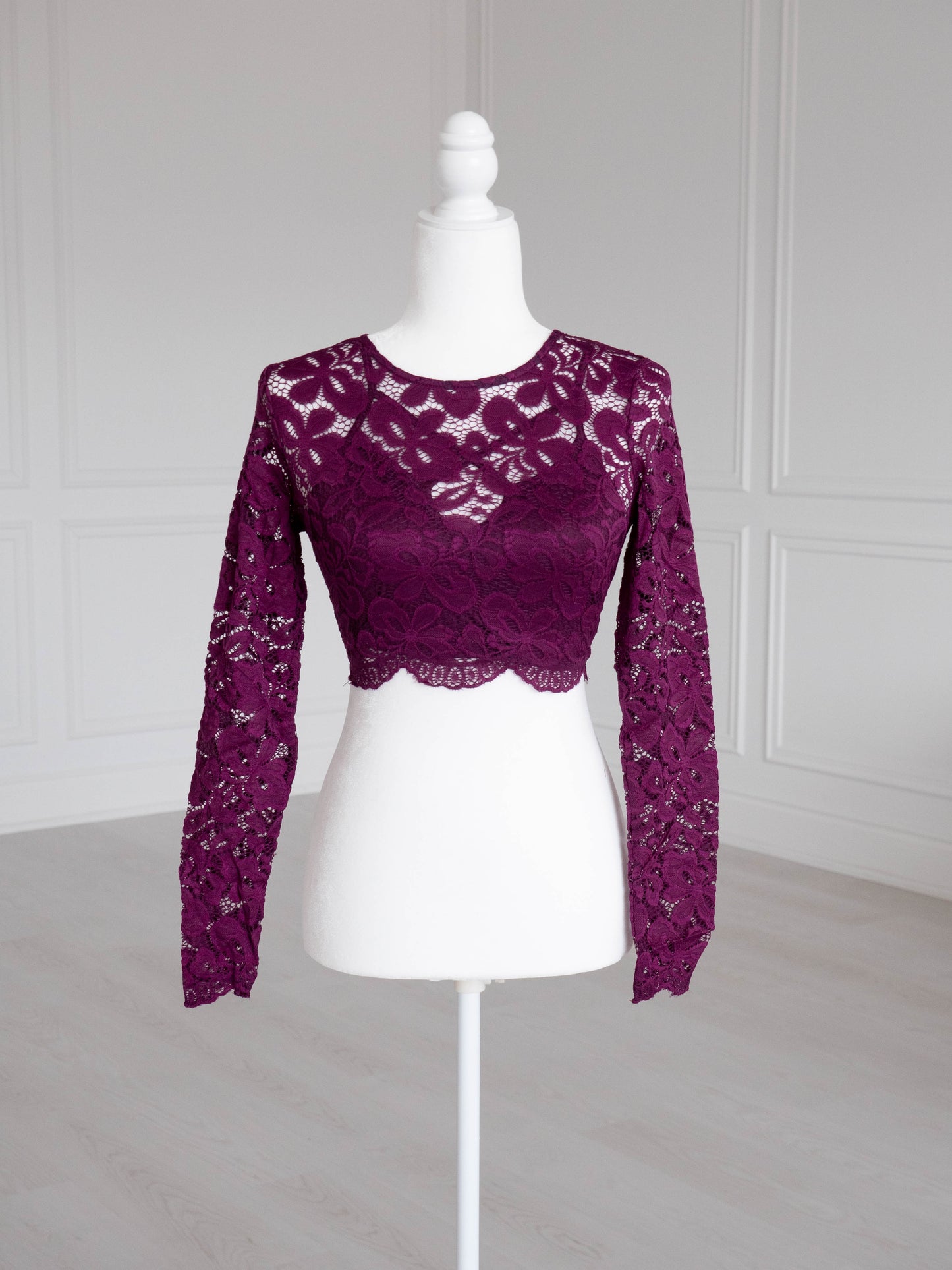 Plum Lace Crop Top with floral pattern, scalloped edges and sheer sleeves, designed to pair with sarees or lehengas. Readymade, fully lined body with reversible neckline.