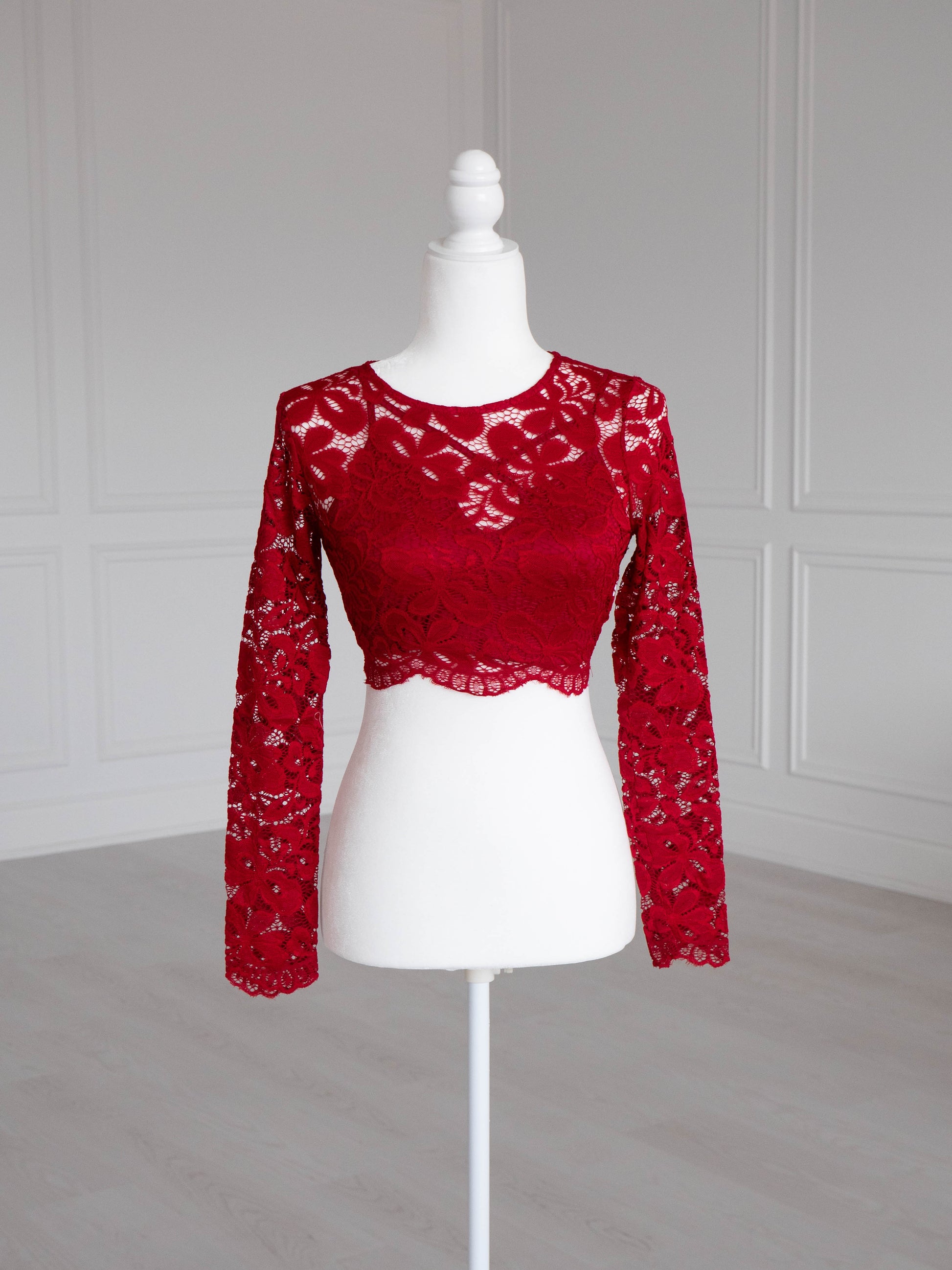 Vino Lace Crop Top with floral pattern, scalloped edges and sheer sleeves, designed to pair with sarees or lehengas. Readymade, fully lined body with reversible neckline.